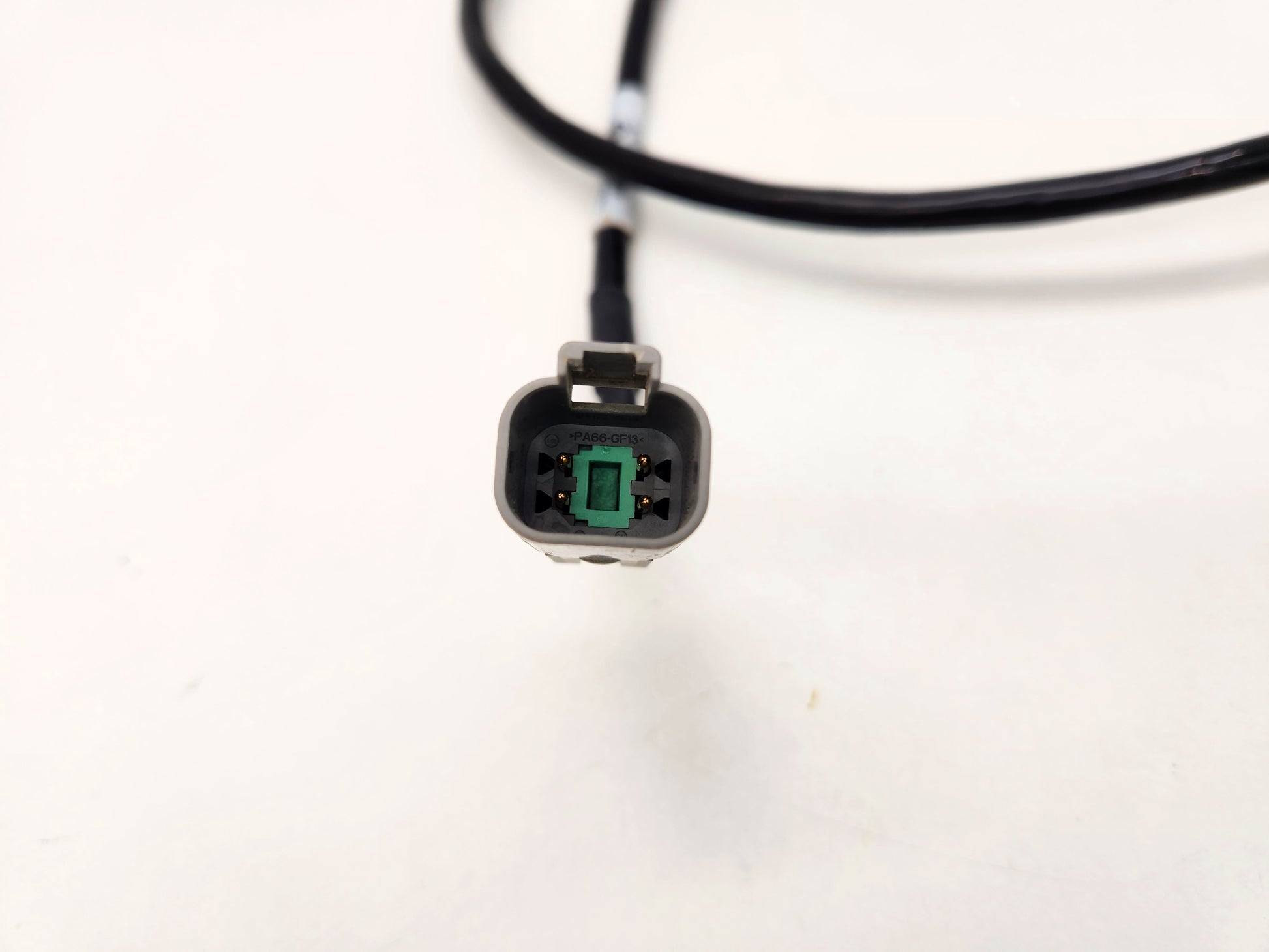 Detailed view of the heavy-duty system connector pins in pristine condition.