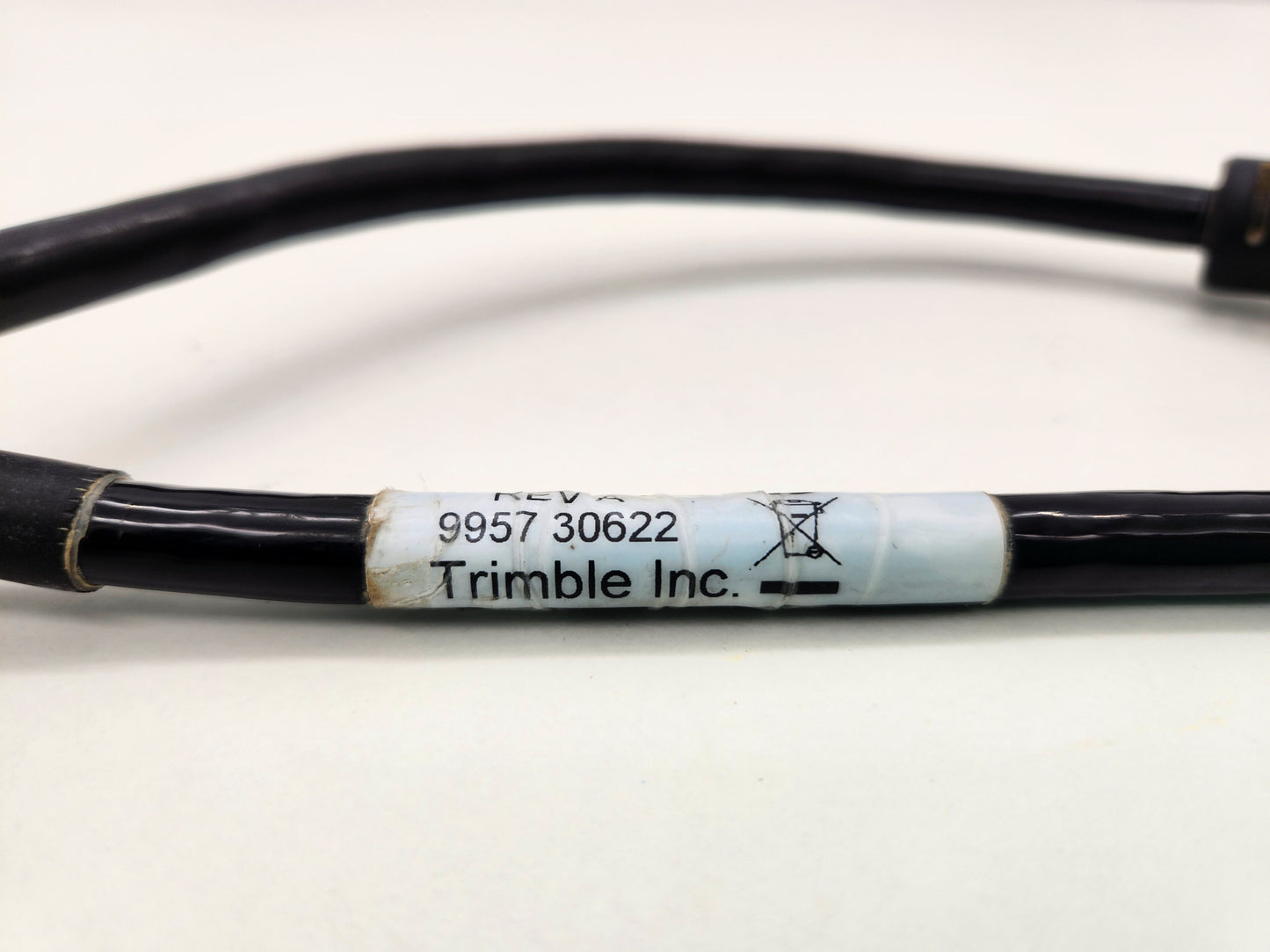 Close-up of the printed part numbers on the Trimble cable sleeve.