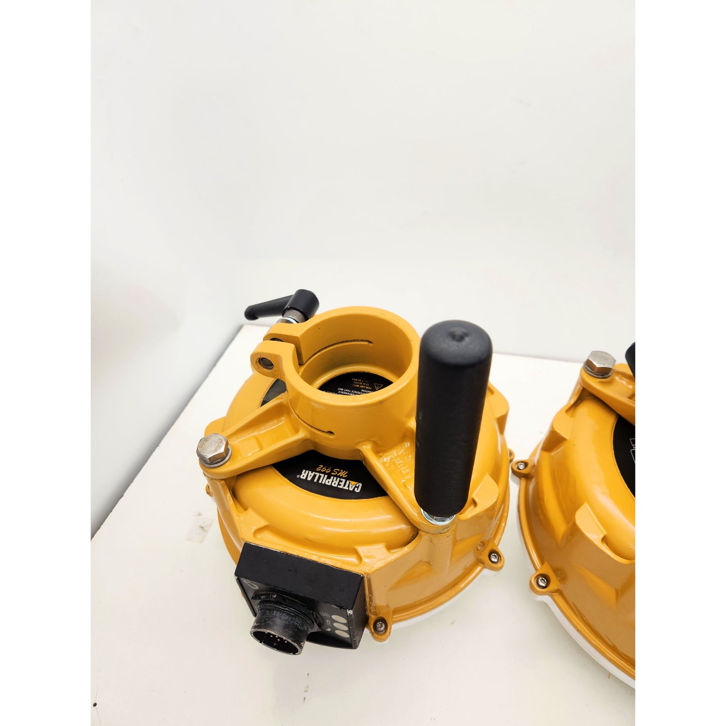 Caterpillar MS992 Smart Antennas with 2 professional mast mounts and handles for easy installation on dozers or graders.